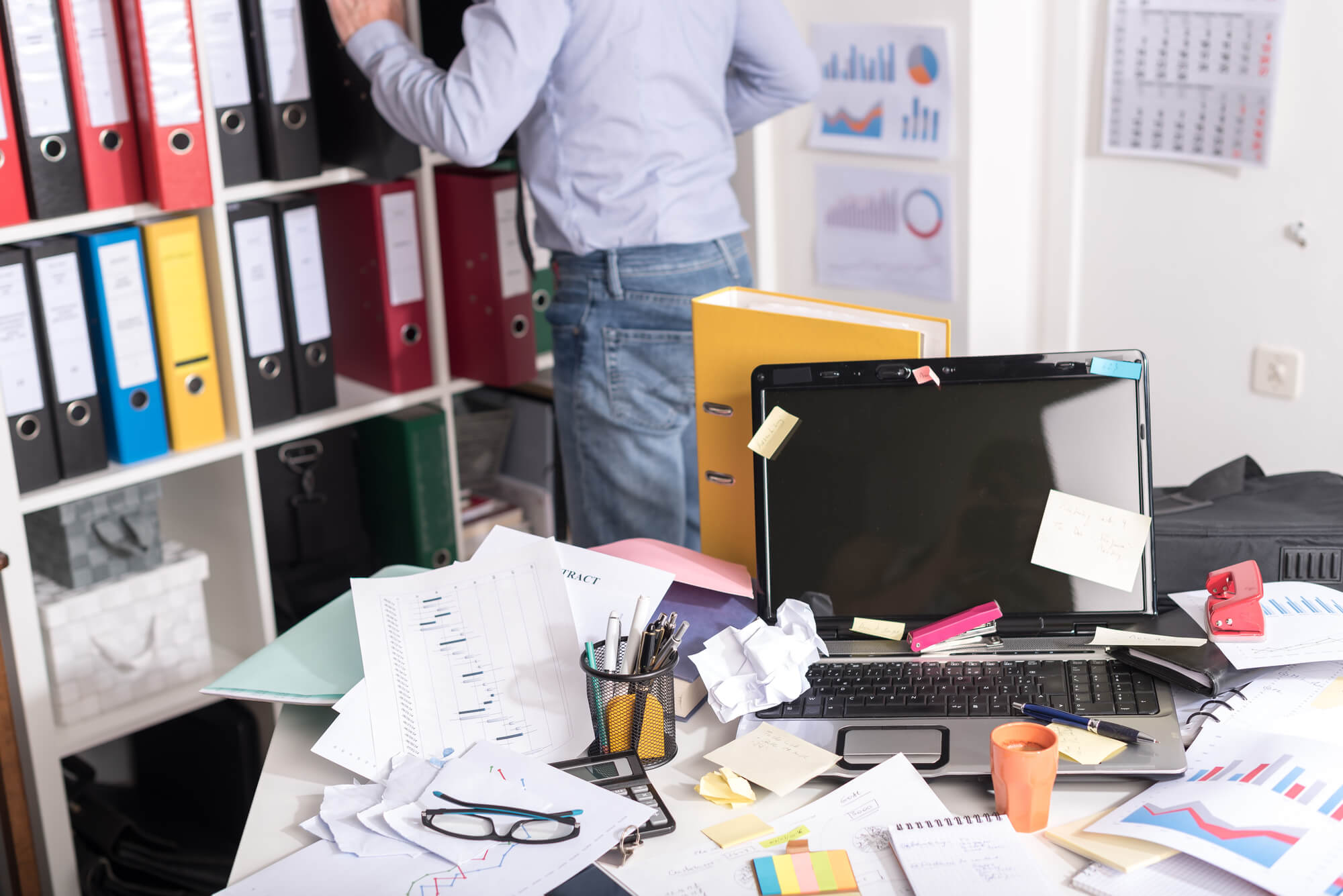 Man in a cluttered room 