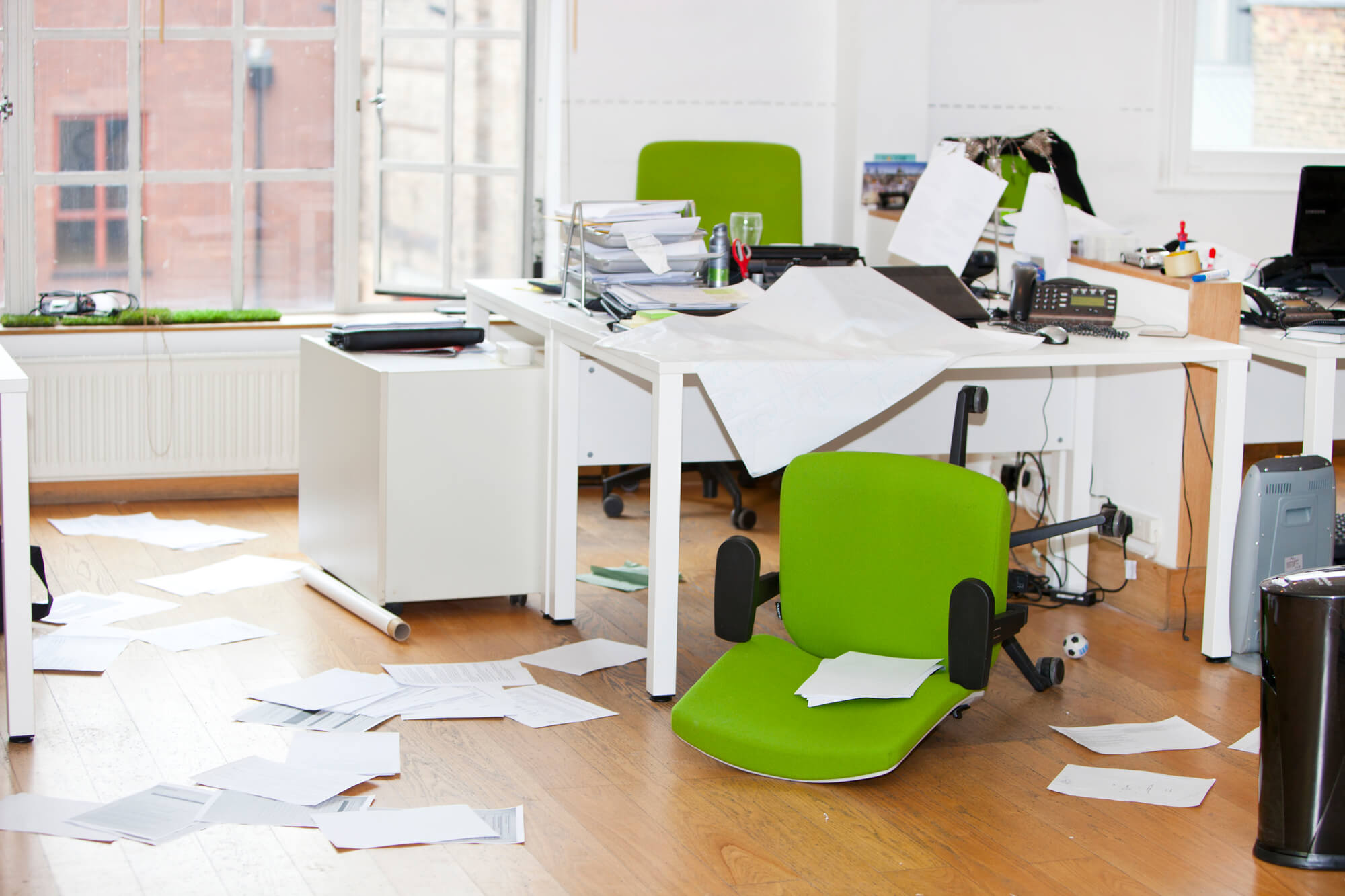 Messy room with fallen green chair