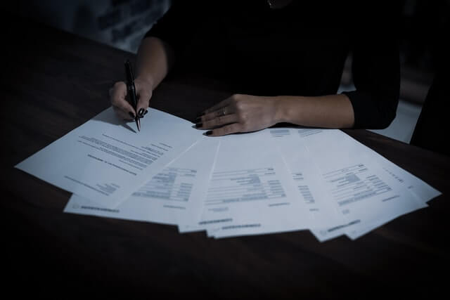 lady signing a probate letter