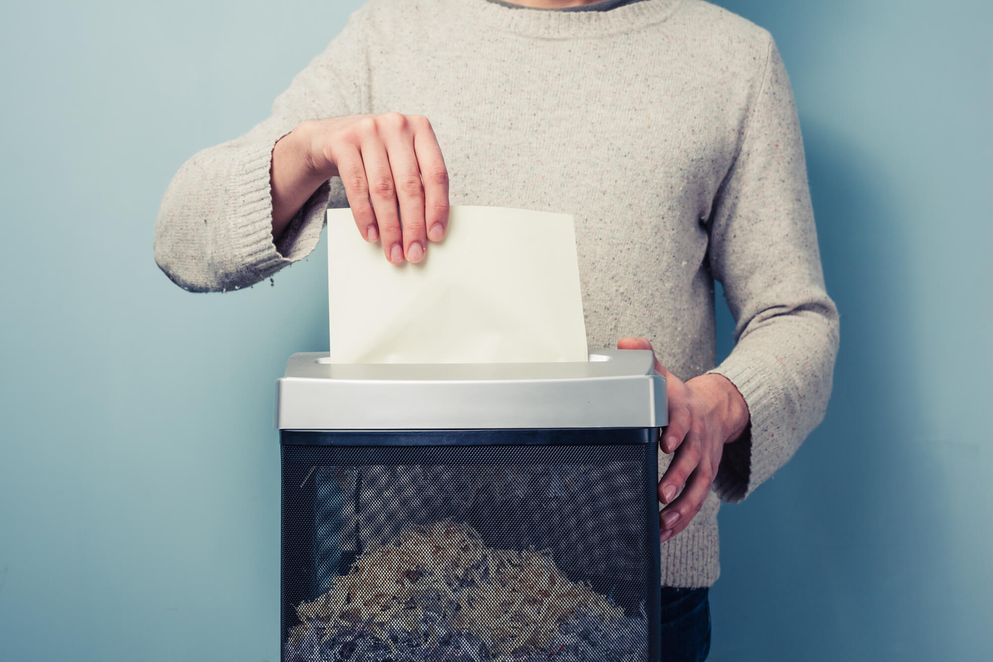 Man shredding a paper