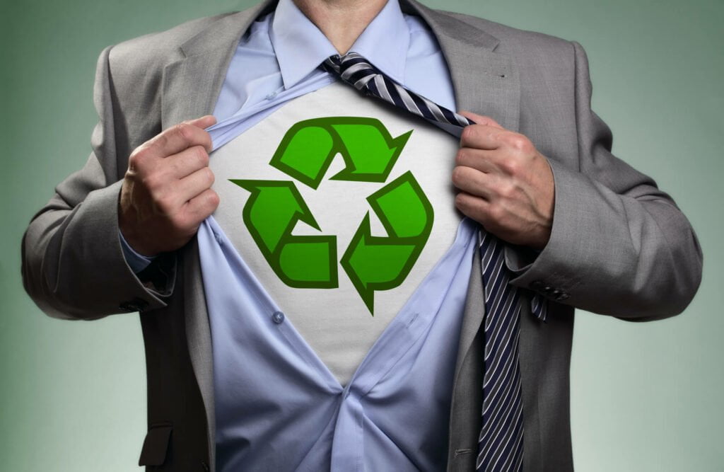 Man with suite wearing a recycle logo on t-shirt