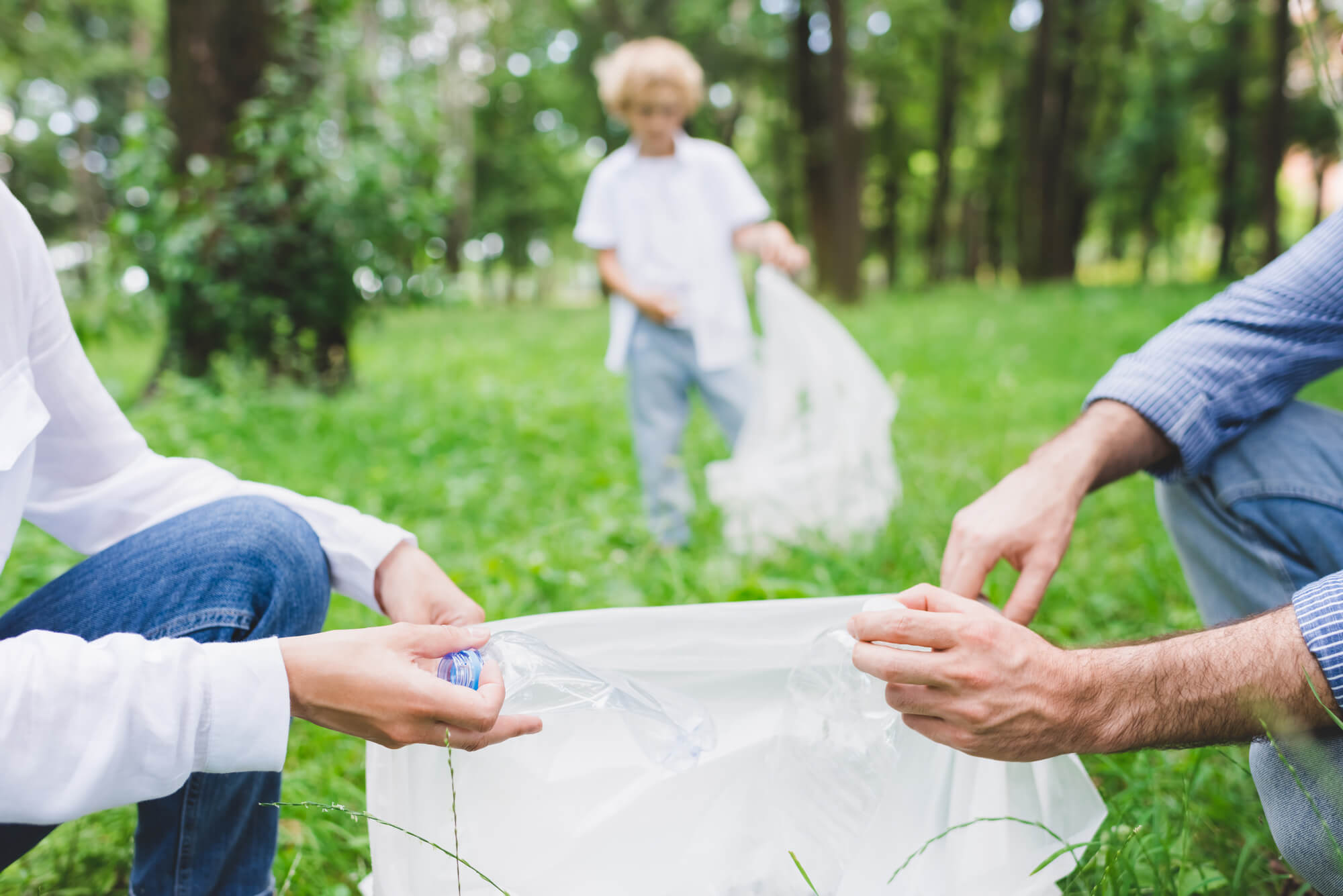 People holding a white plastic bag