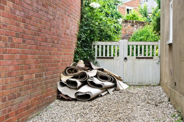 Pile of rubbish next to a house