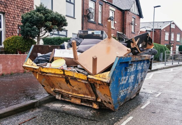 yellow Skip full of waste