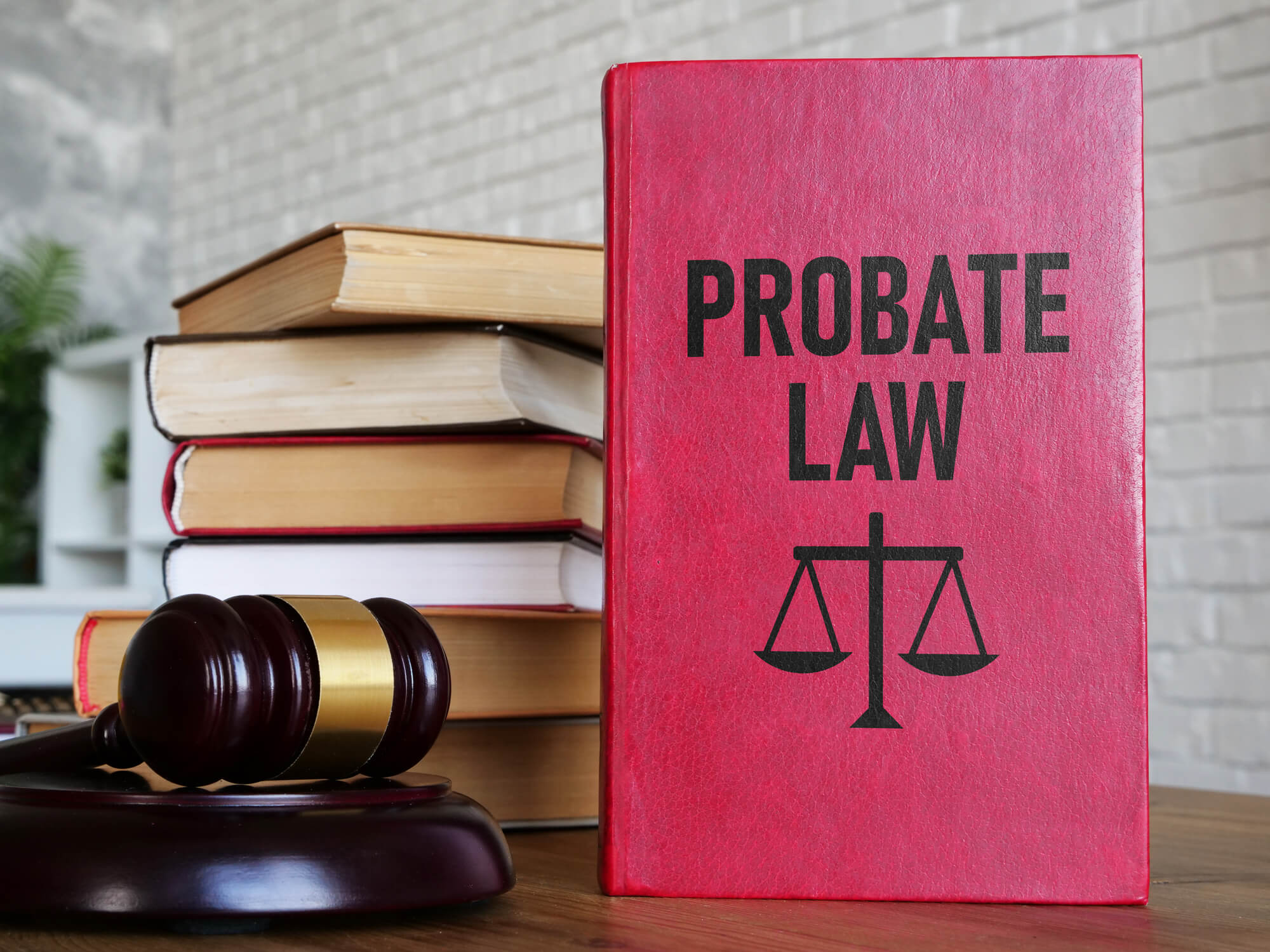 Gavel next to a stack of probate law books