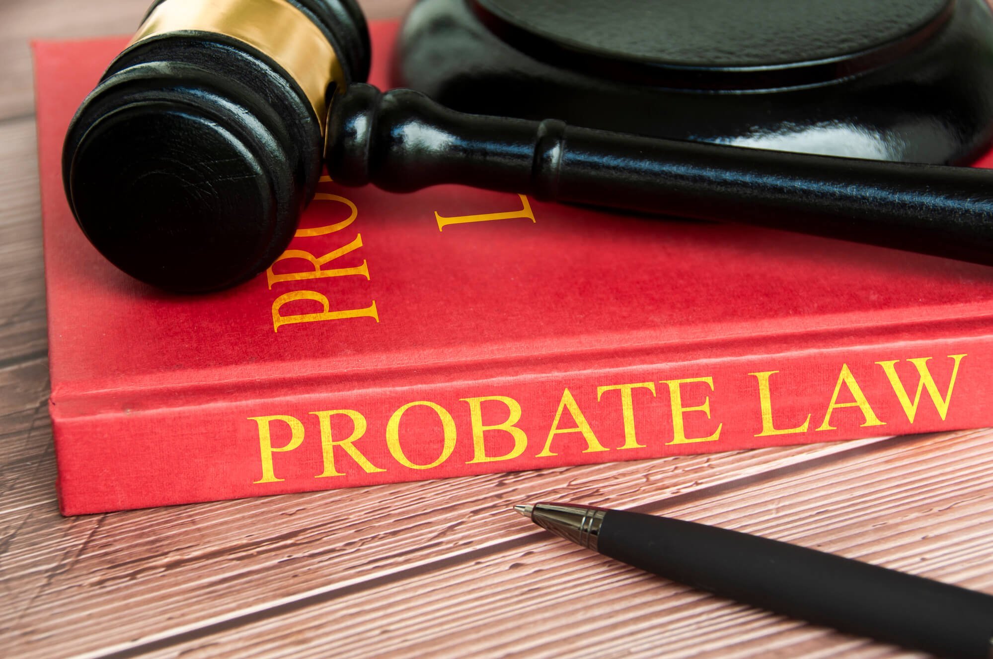 Gavel on a red probate book