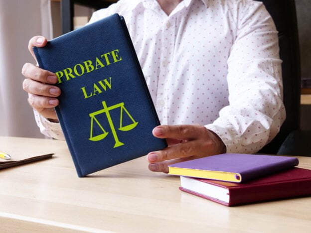 Man holding a probate book